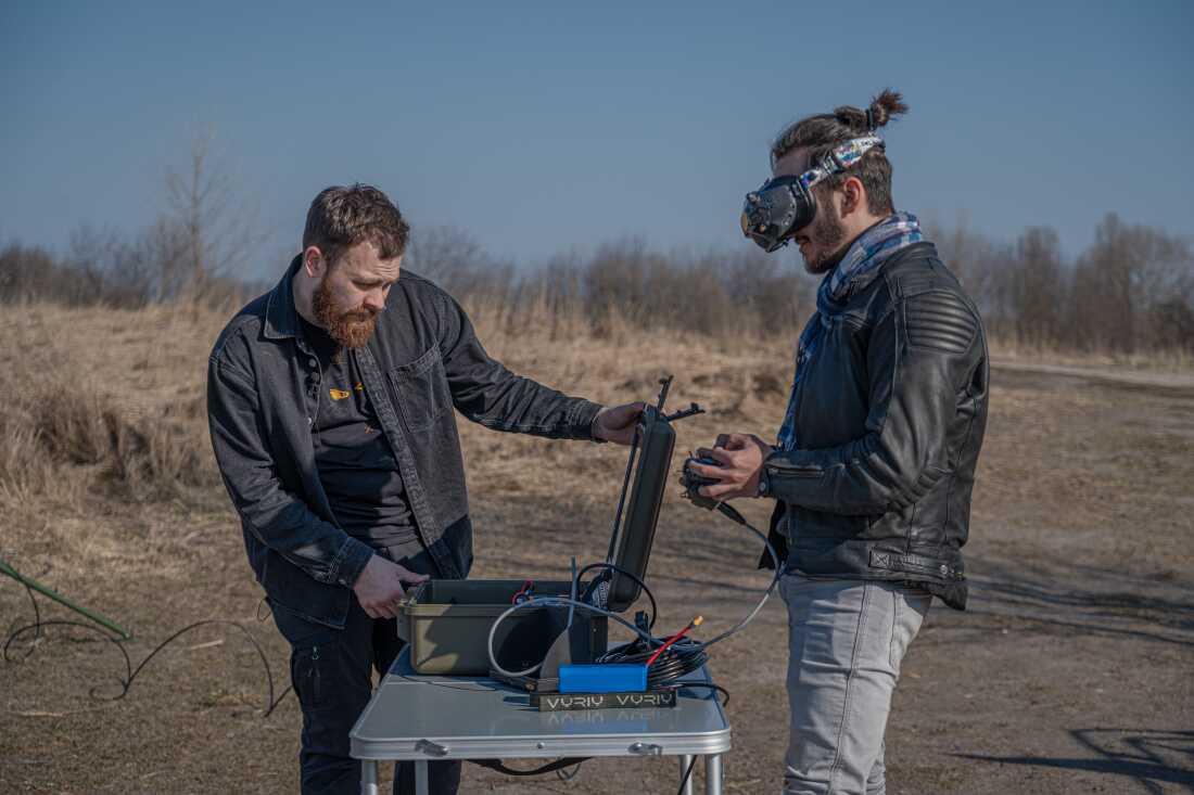 Serhii (right), head of Vyriy production company operating fpv drone on Testing field in Kyiv.