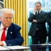 U.S. Treasury Secretary Scott Bessent (L) Commerce Secretary Howard Lutnick (R) look on as President Trump speaks in the Oval Office on Wednesday.